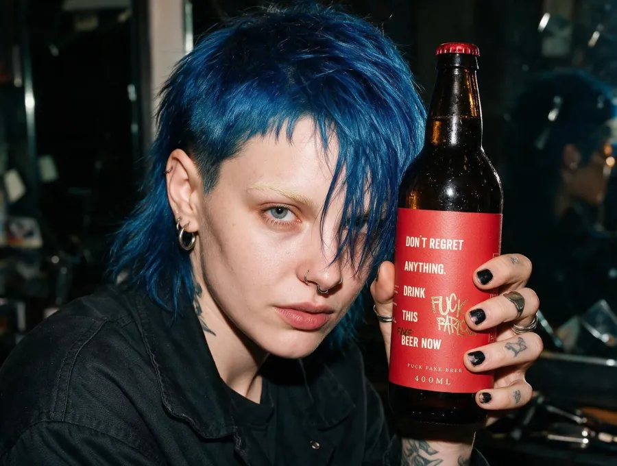 AI portrait with blue hair holding an FK Parlour beer