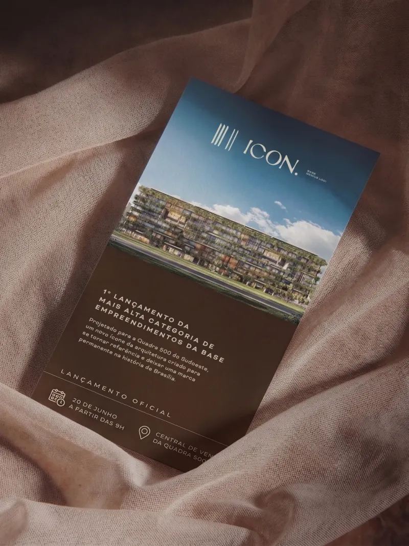 ICON invitation card resting on fabric
