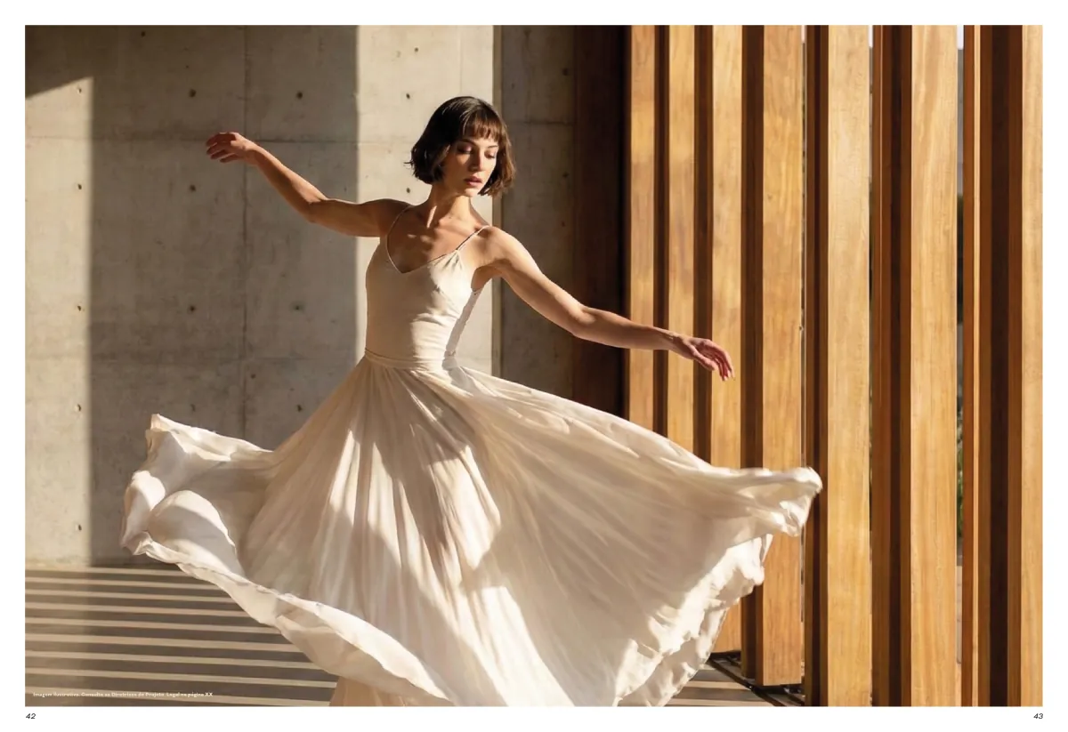 ICON spread: a woman in a white dress turning in the light