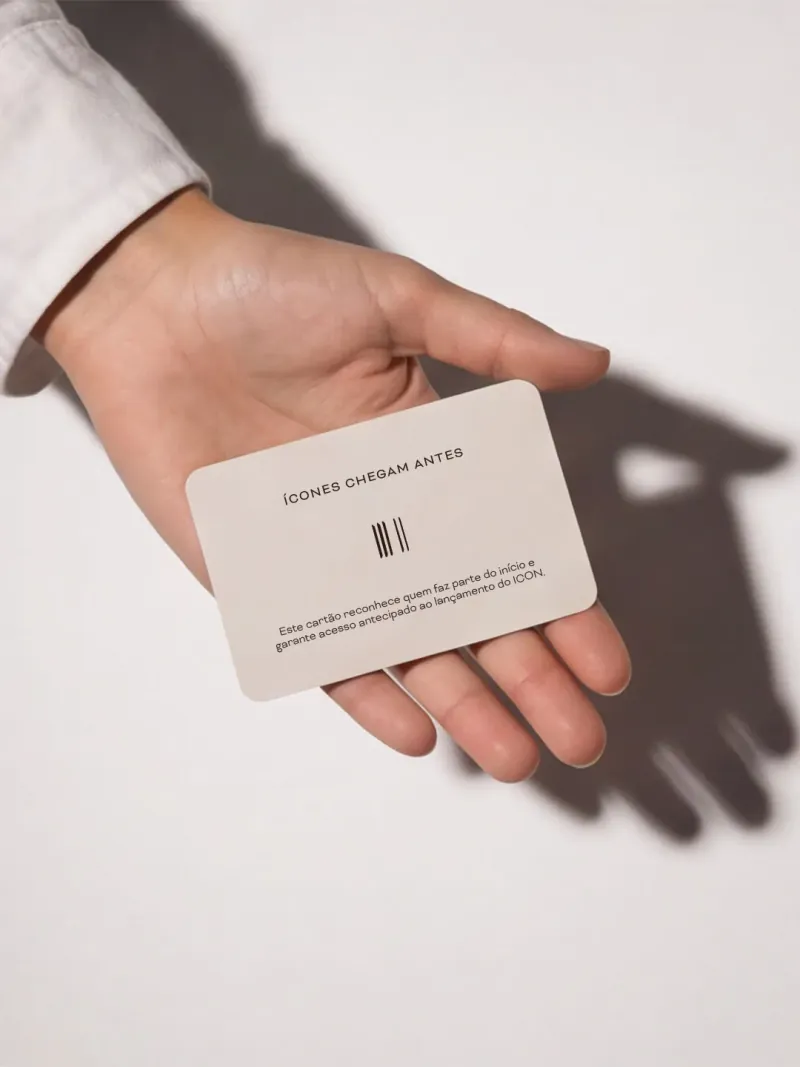 A hand holding the ICON VIP card in hard light
